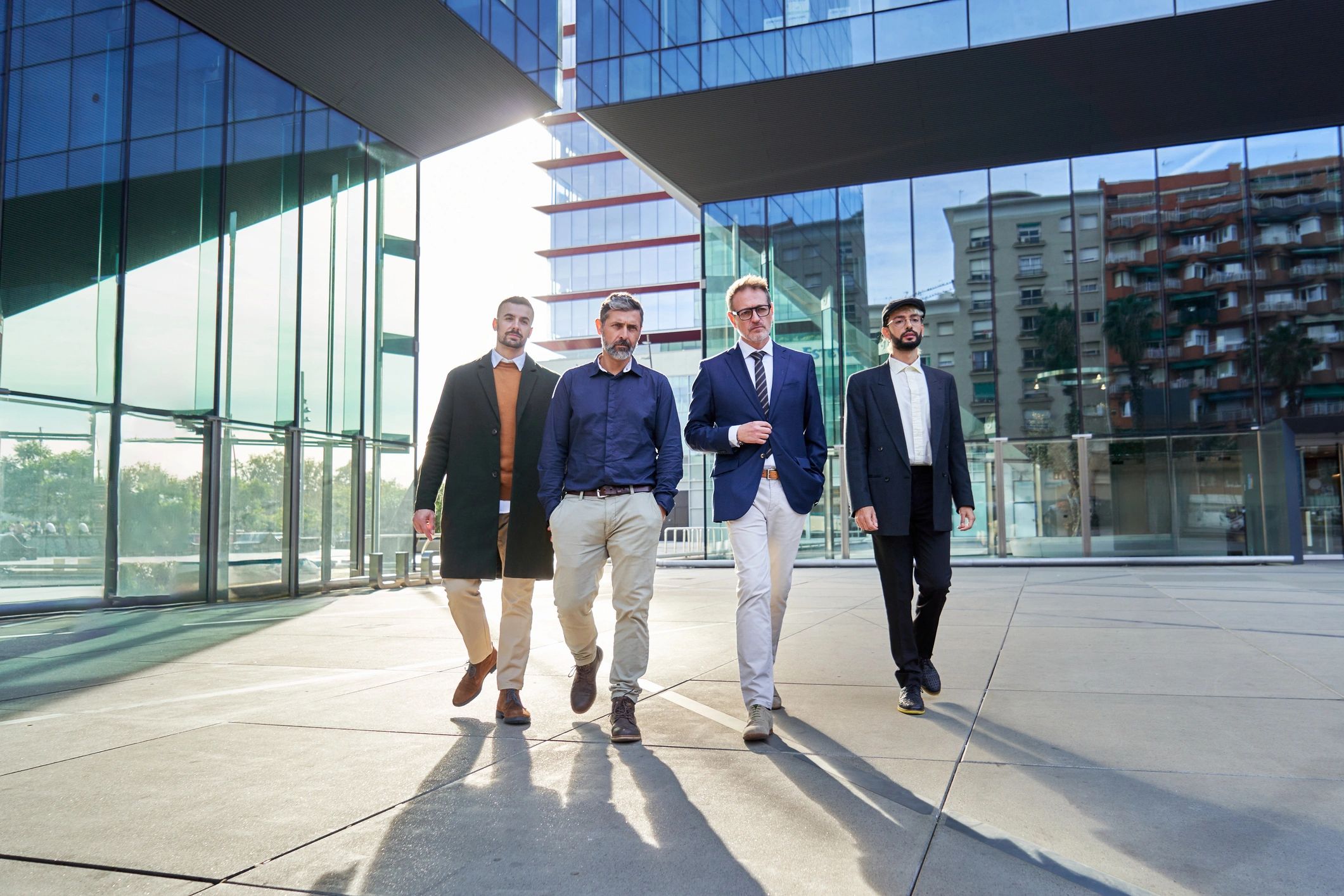 Group of men in coordinated formal attire walking together
